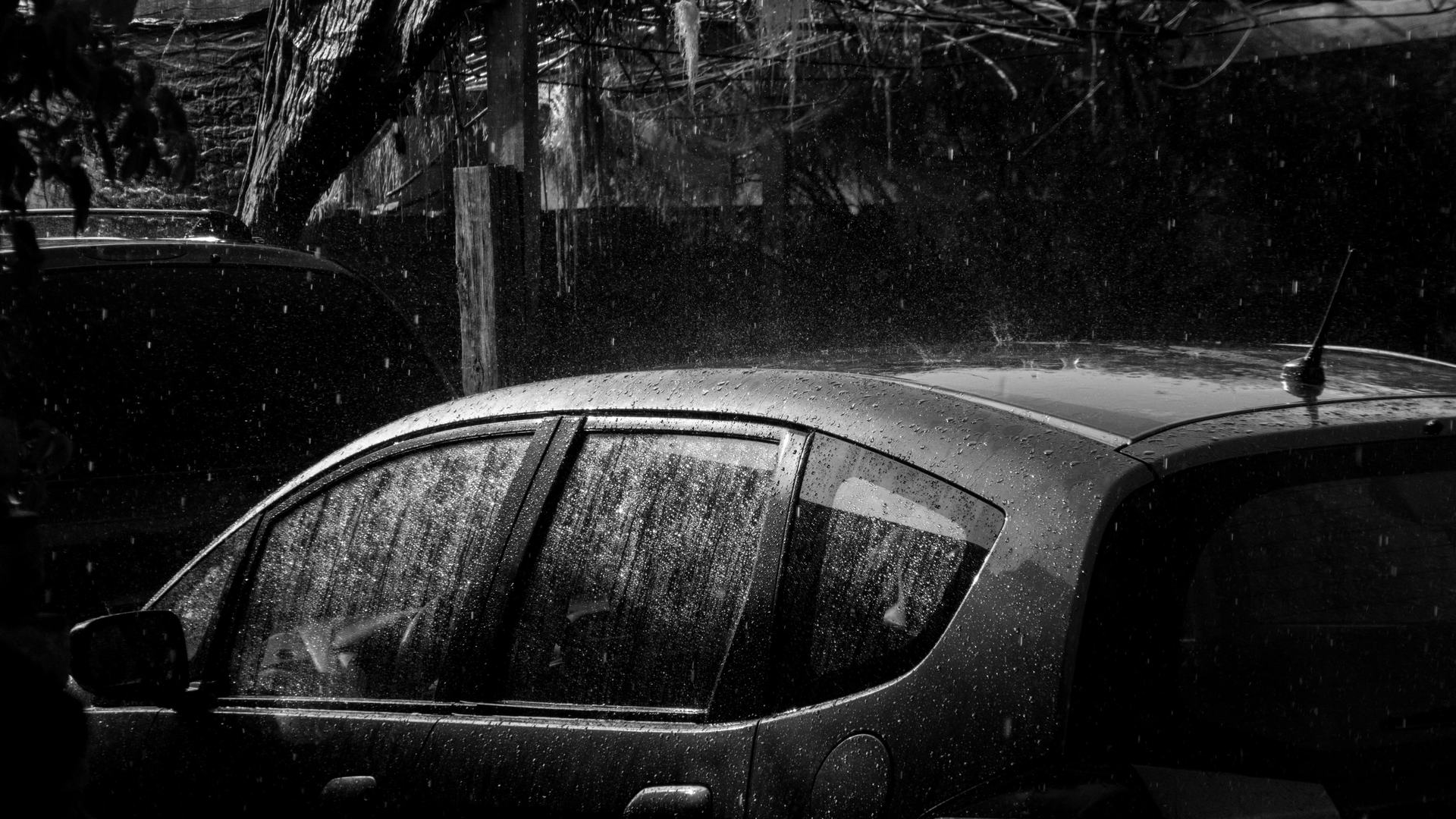 Hailstones covering the roof of a parked car during a North Texas storm